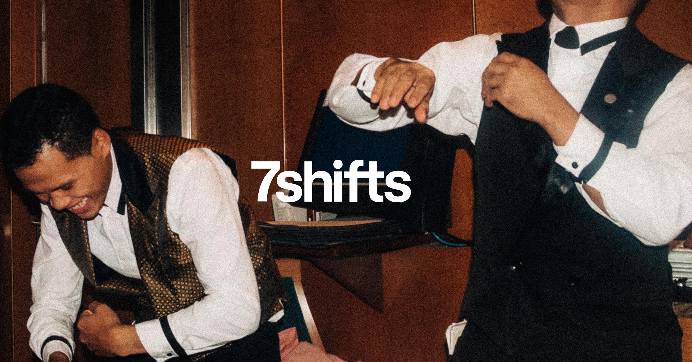 Two male servers in suits.